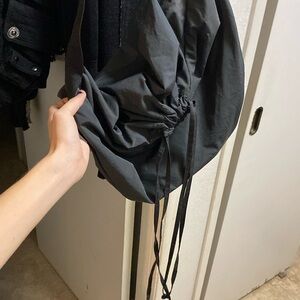 Uniqlo drawstring crossbody bag unisex